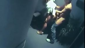 Hidden cam captures hallway sex